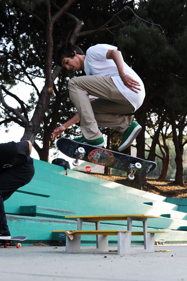 Daniel has a hardflip over this picnic table